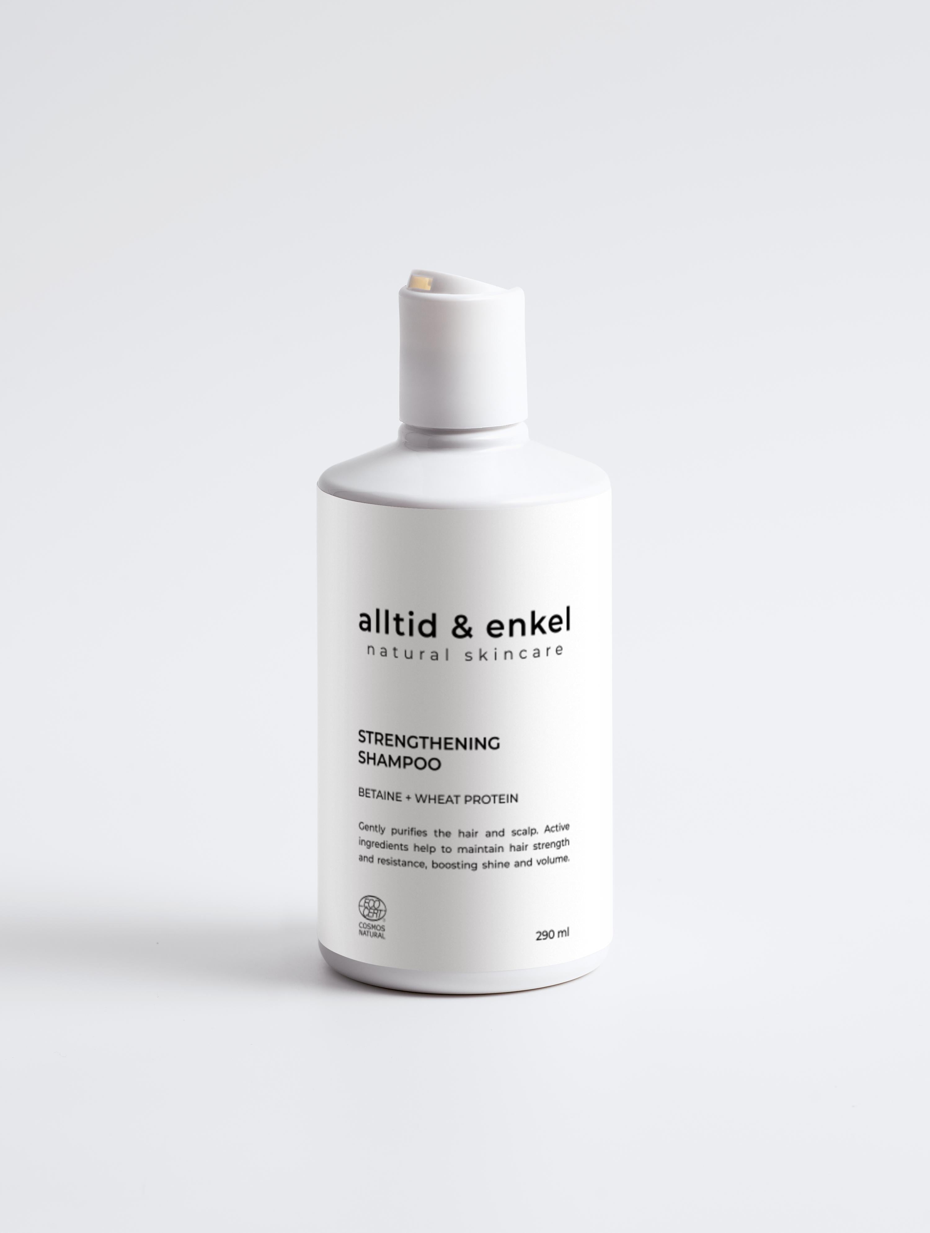 Strengthening shampoo in a sleek white bottle on a white background, 290 ml.